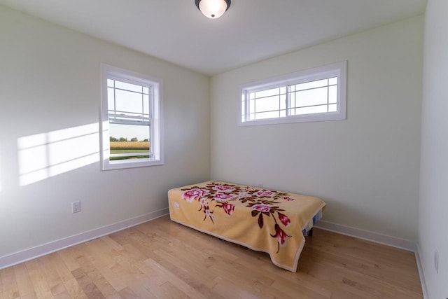 bedroom with light hardwood / wood-style flooring