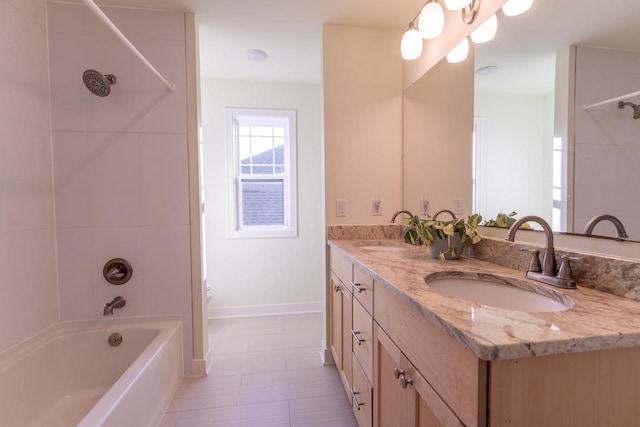 full bathroom with tiled shower / bath combo, vanity, tile patterned floors, and toilet