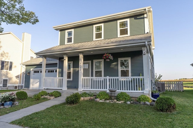 farmhouse with central AC unit, a garage, a front lawn, and covered porch