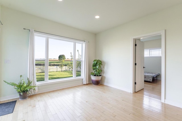 spare room featuring light hardwood / wood-style floors