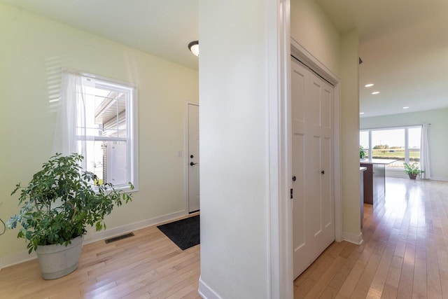 corridor featuring light wood-type flooring