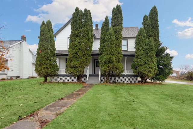 view of front of home featuring a porch and a front lawn