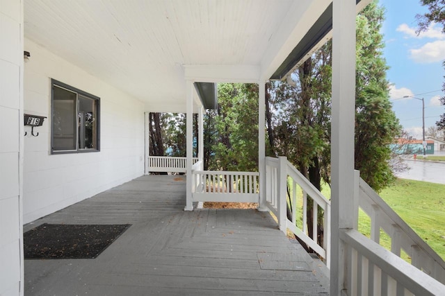 wooden deck featuring covered porch