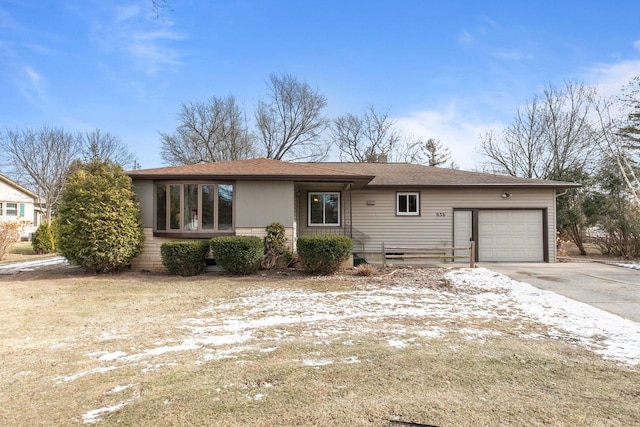 ranch-style house featuring a garage