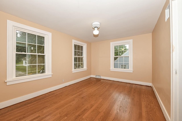 spare room featuring hardwood / wood-style flooring