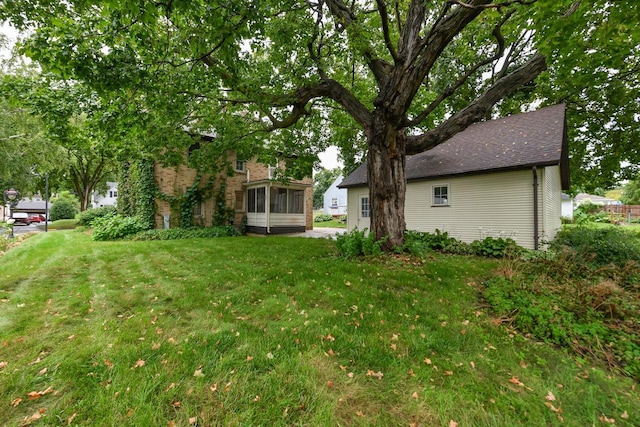 view of yard featuring a sunroom