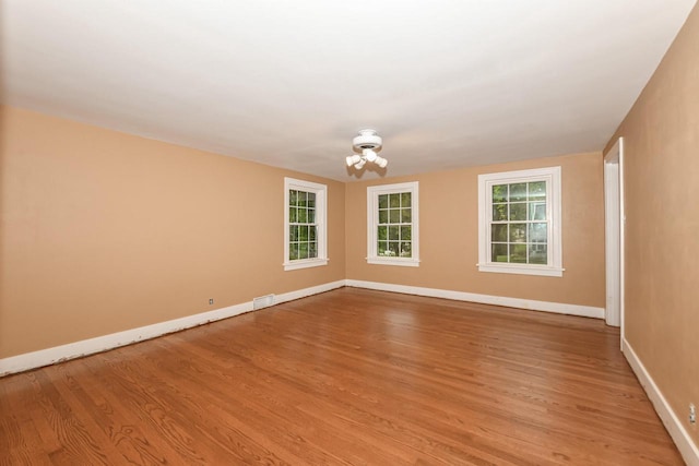 spare room featuring light hardwood / wood-style flooring