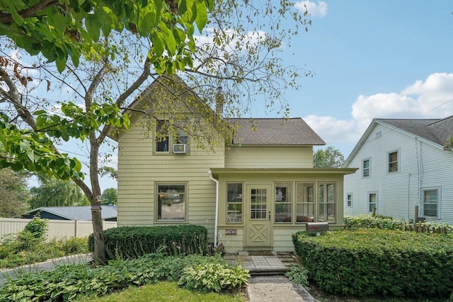 view of front of home featuring a sunroom