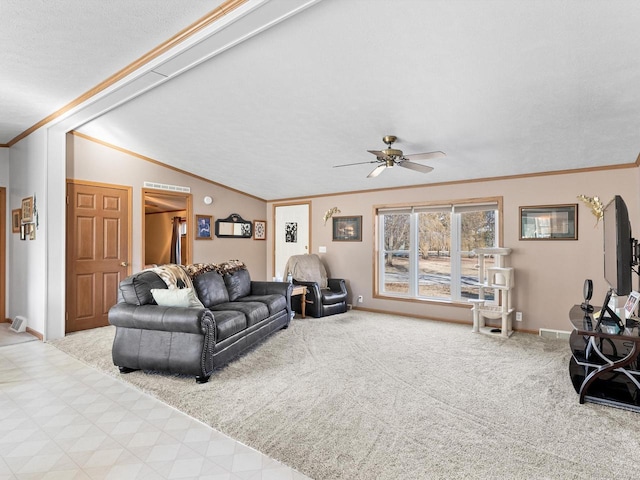 carpeted living room featuring ceiling fan, lofted ceiling, and ornamental molding