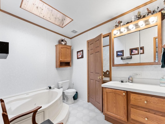 bathroom featuring a skylight, a tub, ornamental molding, vanity, and toilet