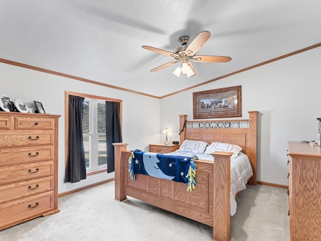 bedroom featuring light carpet, a textured ceiling, crown molding, and ceiling fan