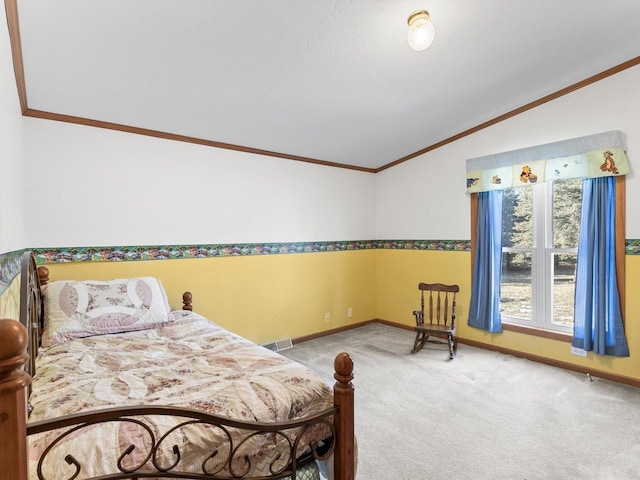 carpeted bedroom featuring crown molding