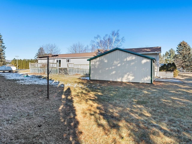 back of house featuring a deck