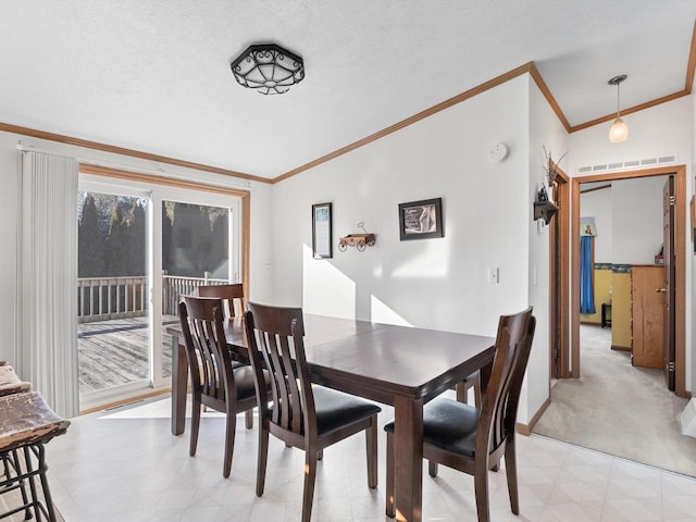 dining room featuring crown molding, vaulted ceiling, and a textured ceiling