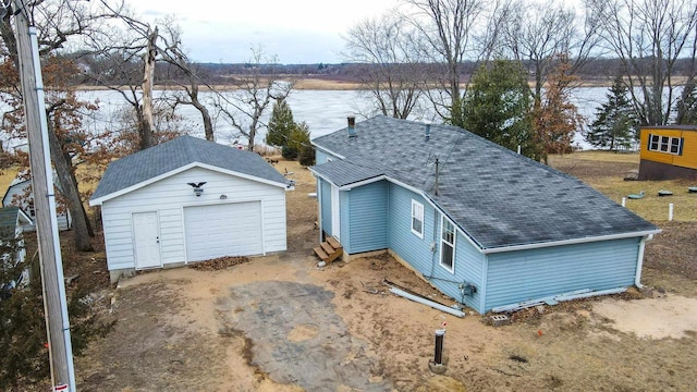 N3005 Lakeview Dr, Montello, WI 53949 - exterior space featuring an outbuilding, a garage, and a water view