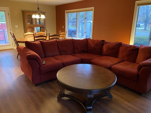 living room with a chandelier and hardwood / wood-style floors