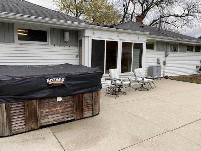 view of patio with a hot tub