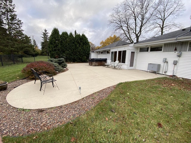 view of patio / terrace with a hot tub