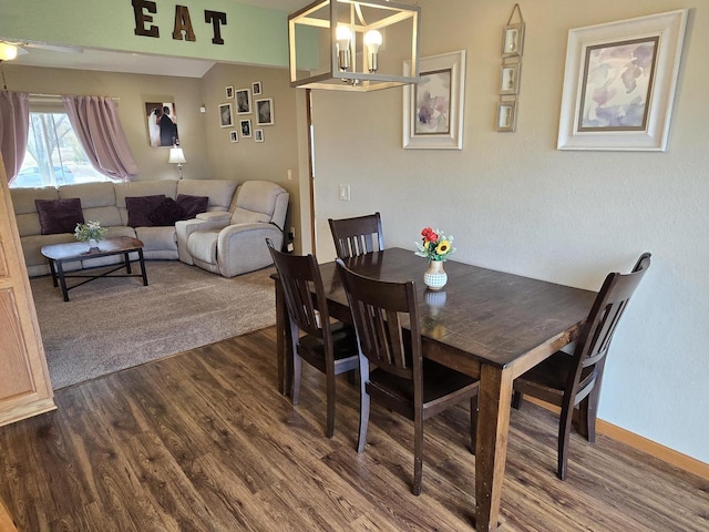 dining space featuring wood-type flooring