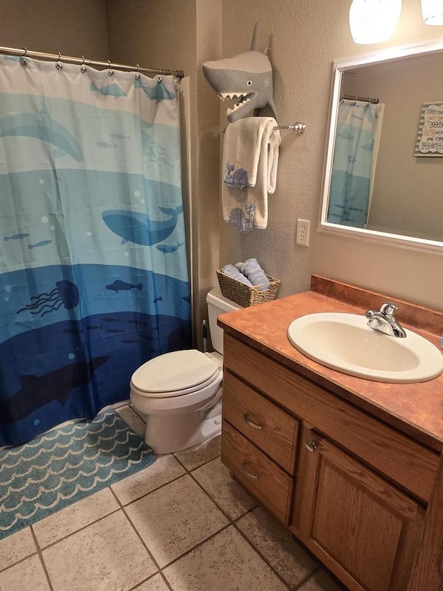 bathroom with vanity, toilet, and a shower with shower curtain