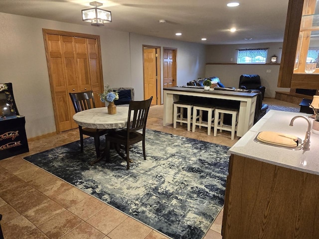 dining room with tile patterned flooring and sink