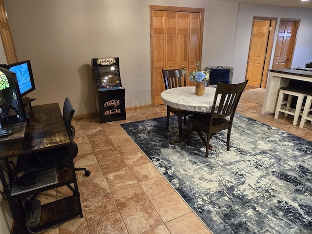 dining area featuring tile patterned flooring