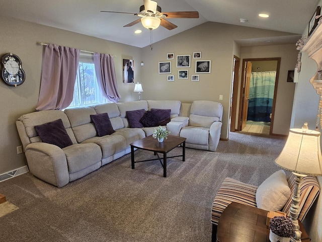 living room featuring vaulted ceiling, carpet, and ceiling fan