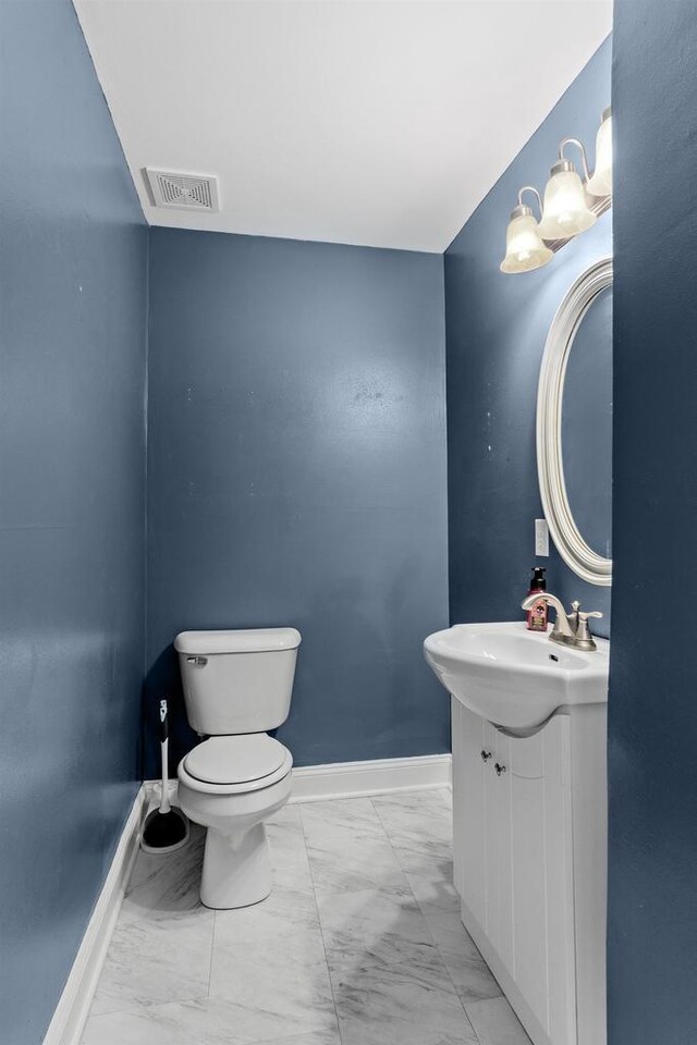 1033 Vernon St, Stoughton, WI 53589 - bathroom with vanity and toilet