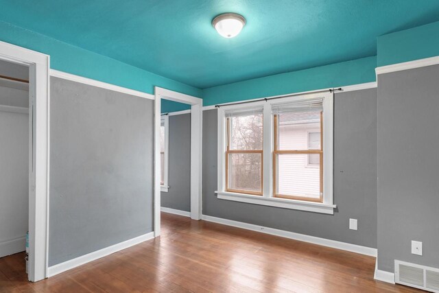 1033 Vernon St, Stoughton, WI 53589 - unfurnished bedroom with hardwood / wood-style flooring