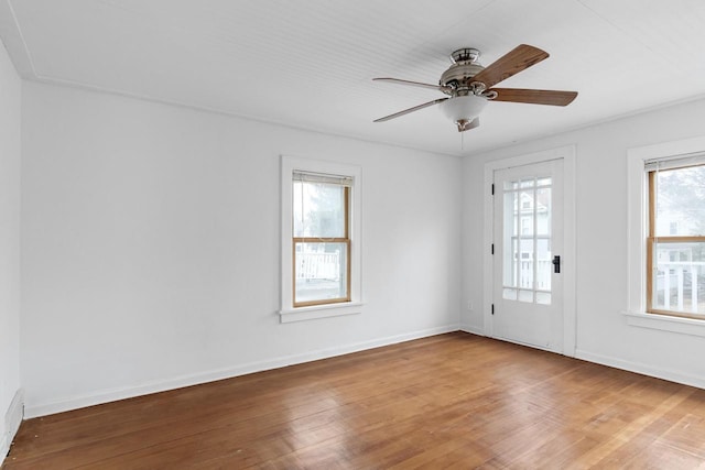 1033 Vernon St, Stoughton, WI 53589 - unfurnished room with ceiling fan and wood-type flooring