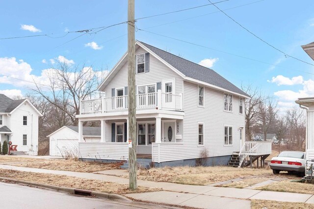 1033 Vernon St, Stoughton, WI 53589 - front facade featuring a balcony and a porch