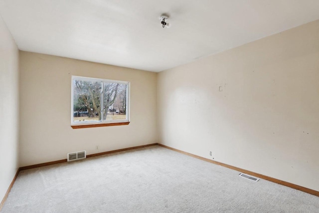 unfurnished room featuring carpet