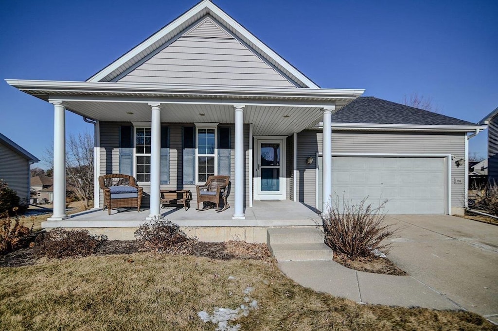 view of front of house with a garage and covered porch