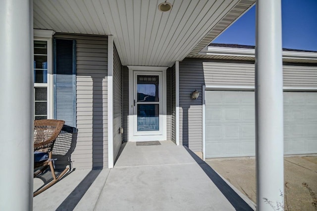 doorway to property with a garage