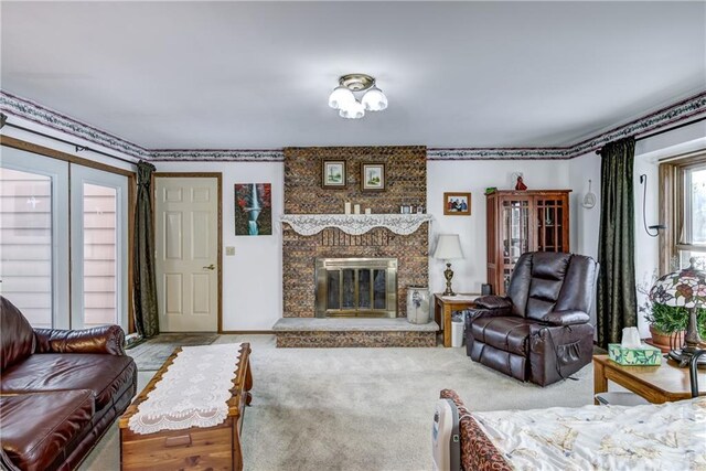 living room featuring a fireplace and carpet floors