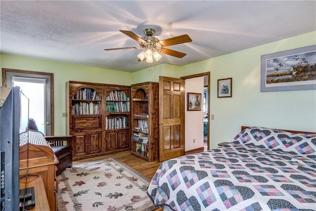bedroom featuring ceiling fan and light hardwood / wood-style floors