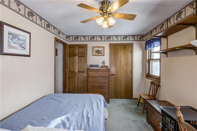 carpeted bedroom featuring ceiling fan