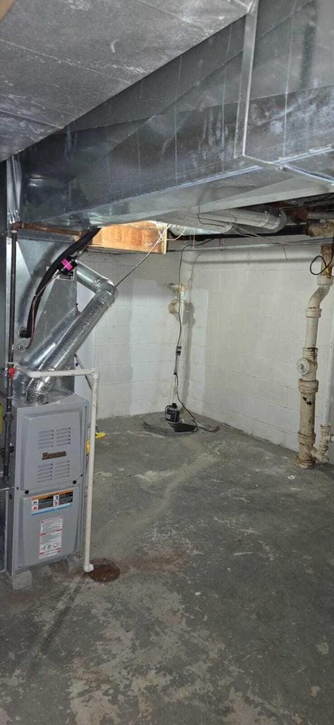 basement featuring heating unit