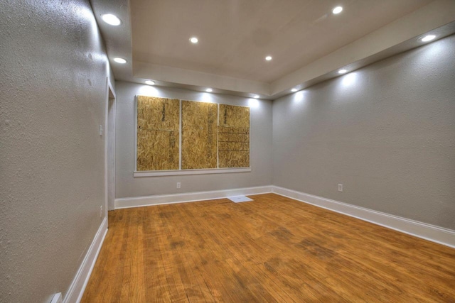 spare room with hardwood / wood-style flooring