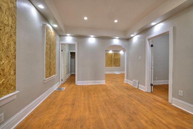 empty room with light hardwood / wood-style floors