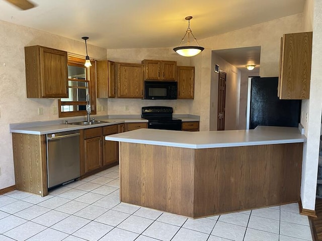 kitchen with lofted ceiling, sink, hanging light fixtures, kitchen peninsula, and black appliances