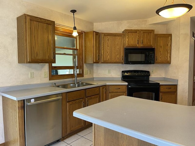 kitchen with light tile patterned flooring, sink, pendant lighting, and black appliances