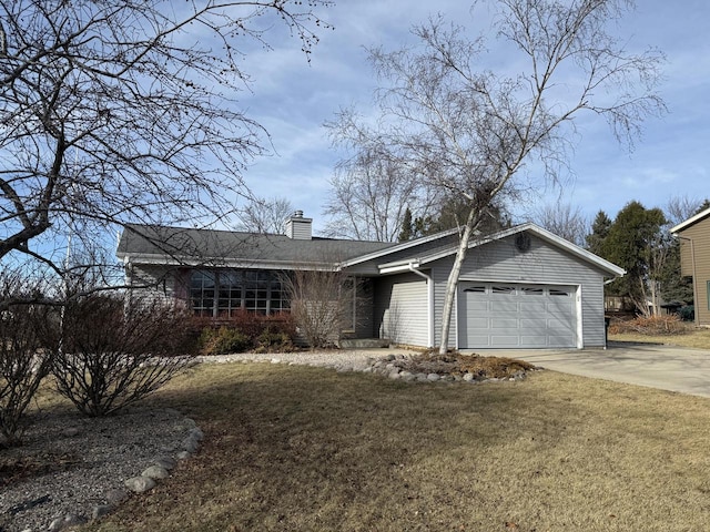 ranch-style home featuring a garage and a front yard