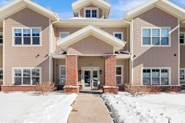 townhome / multi-family property featuring french doors