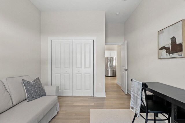 office space featuring light wood-style floors and baseboards