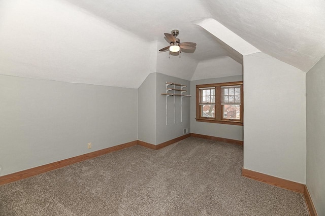 bonus room with lofted ceiling, ceiling fan, and carpet