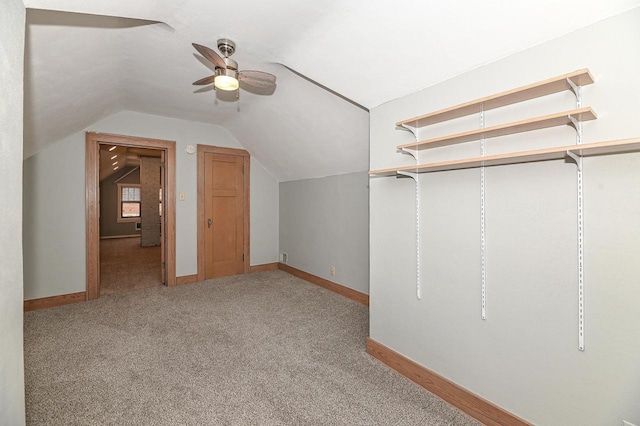 bonus room featuring lofted ceiling, light carpet, and ceiling fan