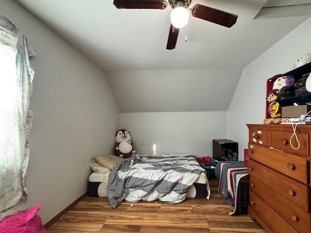 bedroom with wood-type flooring, lofted ceiling, and ceiling fan