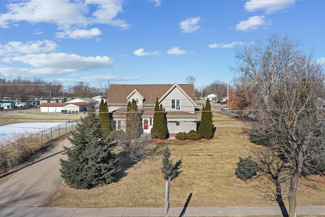 view of front of home featuring a garage and a front yard