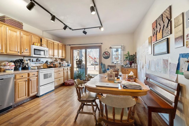 kitchen featuring white appliances, light hardwood / wood-style flooring, rail lighting, and light brown cabinets